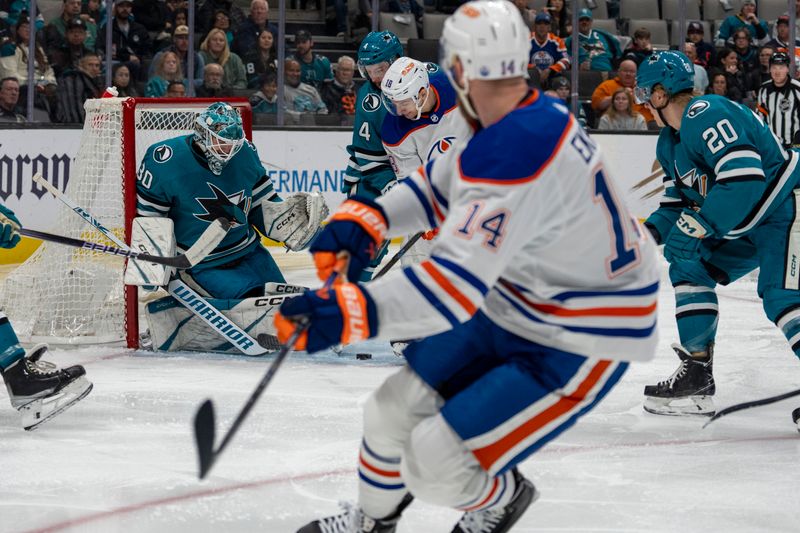 Dec 28, 2023; San Jose, California, USA; San Jose Sharks goalie Magnus Chrona (30) makes a save against Edmonton Oilers left wing Zach Hyman (18) during the first period at SAP Center at San Jose. Mandatory Credit: Neville E. Guard-USA TODAY Sports