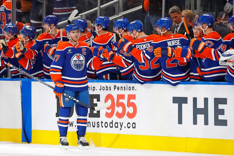 Oct 22, 2024; Edmonton, Alberta, CAN; The Edmonton Oilers celebrate a goal scored by forward Connor McDavid (97) during the second period against the Carolina Hurricanes at Rogers Place. Mandatory Credit: Perry Nelson-Imagn Images