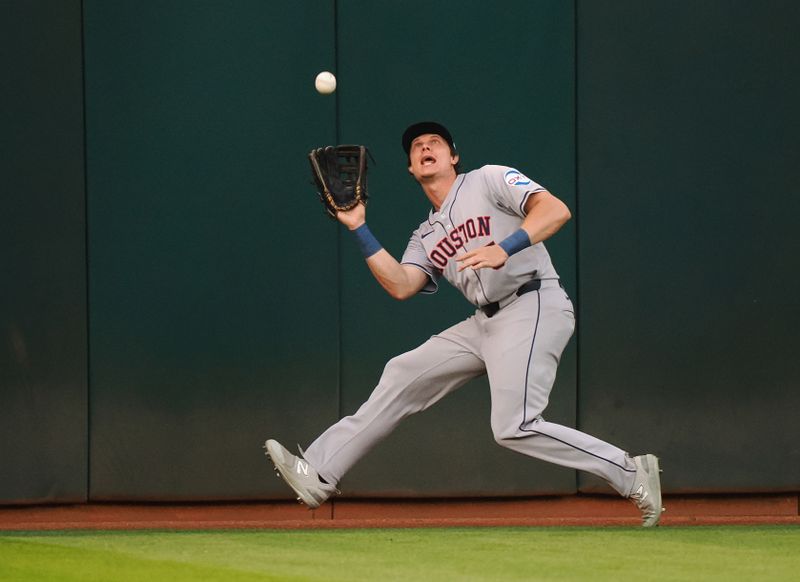 Jul 22, 2024; Oakland, California, USA; Houston Astros center fielder Jake Myers (6) catches the ball against the Oakland Athletics during the fifth inning at Oakland-Alameda County Coliseum. Mandatory Credit: Kelley L Cox-USA TODAY Sports