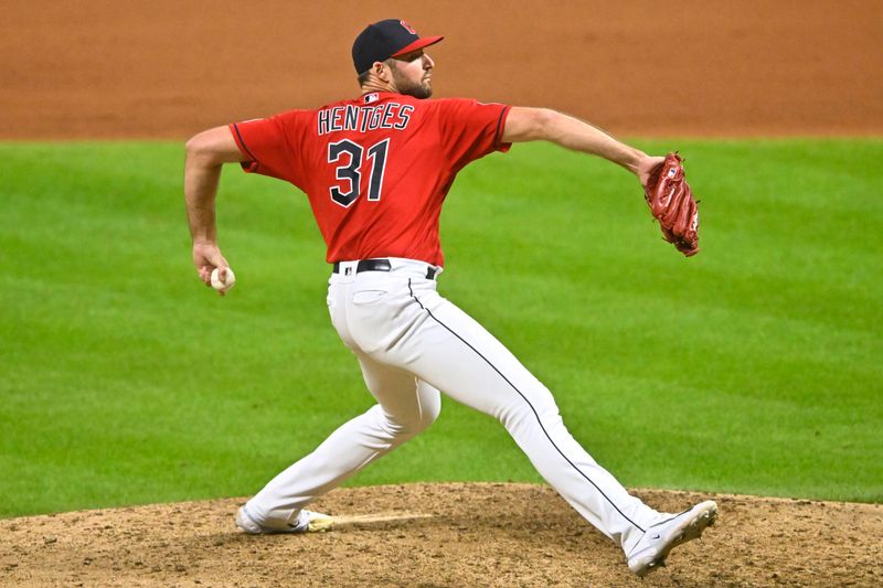 Sep 2, 2023; Cleveland, Ohio, USA; Cleveland Guardians relief pitcher Sam Hentges (31) delivers against the Tampa Bay Rays in the eleventh inning at Progressive Field. Mandatory Credit: David Richard-USA TODAY Sports