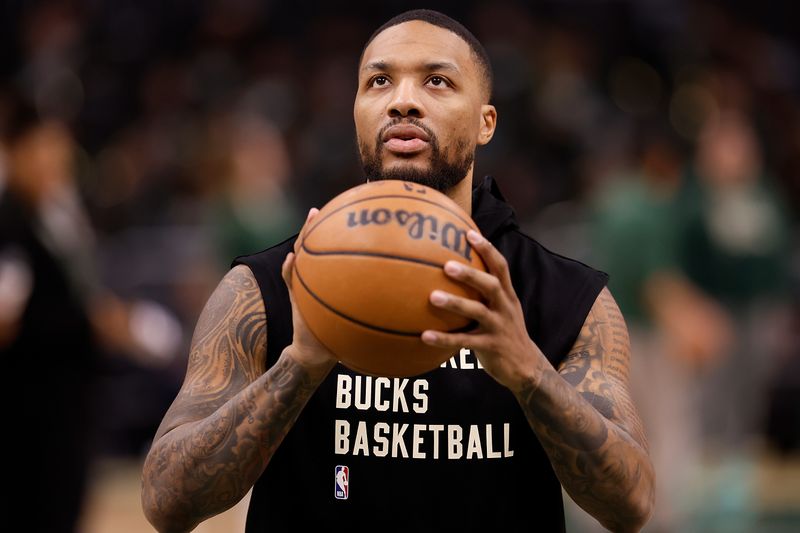 MILWAUKEE, WISCONSIN - JANUARY 14: Damian Lillard #0 of the Milwaukee Bucks warms up before the game against the Sacramento Kings at Fiserv Forum on January 14, 2024 in Milwaukee, Wisconsin. NOTE TO USER: User expressly acknowledges and agrees that, by downloading and or using this photograph, User is consenting to the terms and conditions of the Getty Images License Agreement. (Photo by John Fisher/Getty Images)