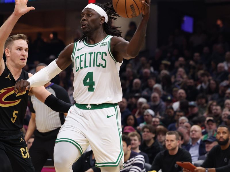 CLEVELAND, OH - MARCH 5: Jrue Holiday #4 of the Boston Celtics looks to pass the ball during the game against the Cleveland Cavaliers on March 5, 2024 at Rocket Mortgage FieldHouse in Cleveland, Ohio. NOTE TO USER: User expressly acknowledges and agrees that, by downloading and/or using this Photograph, user is consenting to the terms and conditions of the Getty Images License Agreement. Mandatory Copyright Notice: Copyright 2024 NBAE (Photo by Lauren Leigh Bacho<p><br/></p>/NBAE via Getty Images)