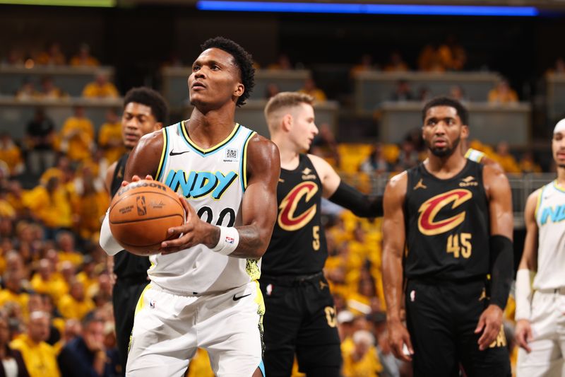 INDIANAPOLIS, IN - MAY 9: Bennedict Mathurin #00 of the Indiana Pacers shoots a free throw during the game against the Cleveland Cavaliers during Round 2 Game 3 on May 9, 2025 at Gainbridge Fieldhouse in Indianapolis, Indiana. NOTE TO USER: User expressly acknowledges and agrees that, by downloading and or using this Photograph, user is consenting to the terms and conditions of the Getty Images License Agreement. Mandatory Copyright Notice: Copyright 2025 NBAE (Photo by Joe Murphy/NBAE via Getty Images)