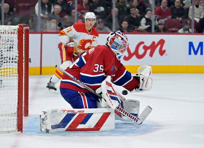 Nov 5, 2024; Montreal, Quebec, CAN; Calgary Flames forward Matt Coronato (27) (not pictured) scores a goal against Montreal Canadiens goalie Sam Montembeault (35) during the third period at the Bell Centre. Mandatory Credit: Eric Bolte-Imagn Images