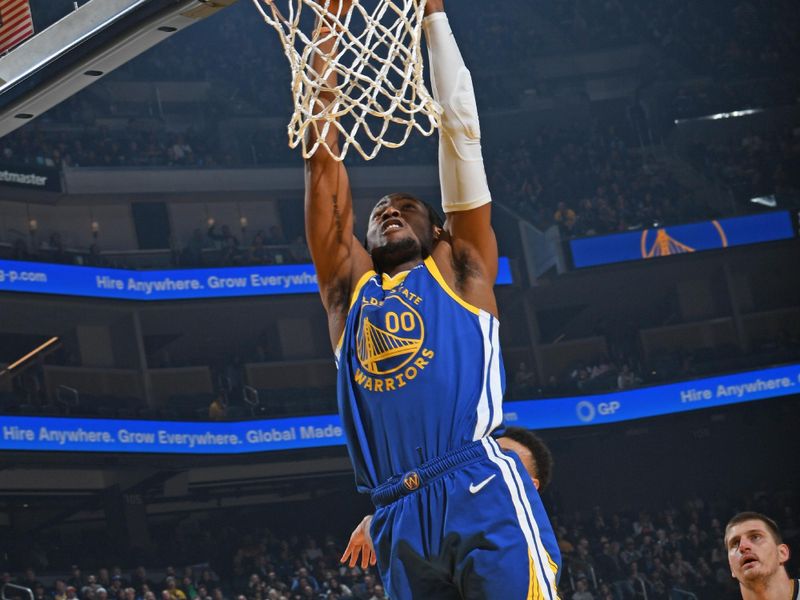 SAN FRANCISCO, CA - JANUARY 4: Jonathan Kuminga #00 of the Golden State Warriors dunks the ball during the game against the Denver Nuggets on January 4, 2024 at Chase Center in San Francisco, California. NOTE TO USER: User expressly acknowledges and agrees that, by downloading and or using this photograph, user is consenting to the terms and conditions of Getty Images License Agreement. Mandatory Copyright Notice: Copyright 2024 NBAE (Photo by Noah Graham/NBAE via Getty Images)