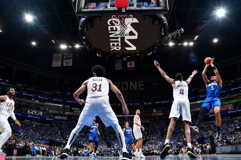 ORLANDO, FL - APRIL 25: Paolo Banchero #5 of the Orlando Magic shoots the ball during the game  against the Cleveland Cavaliers during Round 1 Game 3 of the 2024 NBA Playoffs on April 25, 2024 at Kia Center in Orlando, Florida. NOTE TO USER: User expressly acknowledges and agrees that, by downloading and or using this photograph, User is consenting to the terms and conditions of the Getty Images License Agreement. Mandatory Copyright Notice: Copyright 2023 NBAE (Photo by Fernando Medina/NBAE via Getty Images)