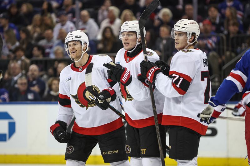 Nov 1, 2024; New York, New York, USA;  Ottawa Senators right wing Adam Gaudette (81) celebrates with his teammates after scoring a goal in the third period against the New York Rangers at Madison Square Garden. Mandatory Credit: Wendell Cruz-Imagn Images