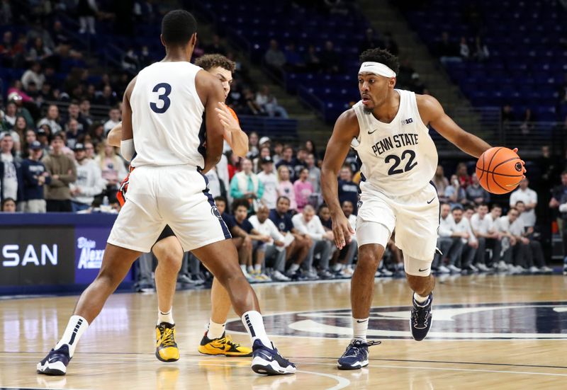 Feb 14, 2023; University Park, Pennsylvania, USA; Penn State Nittany Lions guard Jalen Pickett (22) dribbles the ball around his teammate during the first half against the Illinois Fighting Illini at Bryce Jordan Center. Mandatory Credit: Matthew OHaren-USA TODAY Sports