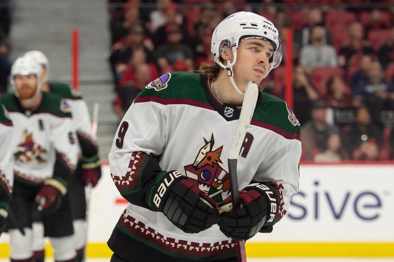 Oct 22, 2022; Ottawa, Ontario, CAN; Arizona Coyotes right wing Clayton Keller (9) skates to the bench following  his goal scored against the Ottawa Senators in the second period at the Canadian Tire Centre. Mandatory Credit: Marc DesRosiers-USA TODAY Sports