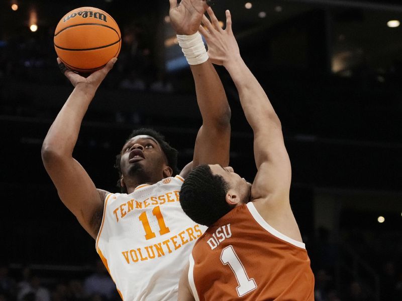 March 23, 2024, Charlotte, NC, USA; Tennessee Volunteers forward Tobe Awaka (11) shoots against Texas Longhorns forward Dylan Disu (1) in the second round of the 2024 NCAA Tournament at the Spectrum Center. Mandatory Credit: Jim Dedmon-USA TODAY Sports