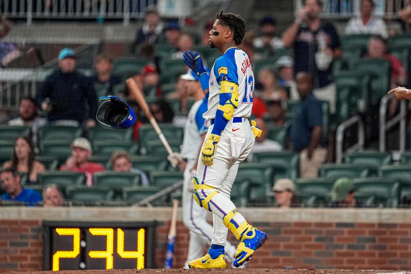 Jun 28, 2025; Cumberland, Georgia, USA; Atlanta Braves right fielder Ronald Acuna Jr (13) reacts after being called out on strikes against the Philadelphia Phillies during the sixth inning at Truist Park. Mandatory Credit: Dale Zanine-Imagn Images