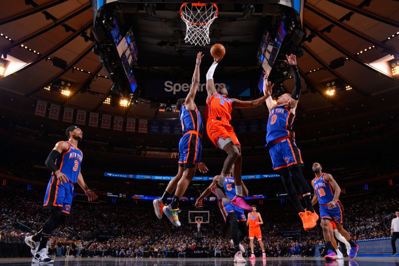 NEW YORK, NY - MARCH 31: Jalen Williams #8 of the Oklahoma City Thunder dunks the ball during the game against the New York Knicks on March 31, 2024 at Madison Square Garden in New York City, New York.  NOTE TO USER: User expressly acknowledges and agrees that, by downloading and or using this photograph, User is consenting to the terms and conditions of the Getty Images License Agreement. Mandatory Copyright Notice: Copyright 2024 NBAE  (Photo by Jesse D. Garrabrant/NBAE via Getty Images)