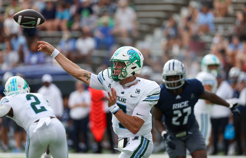 Oct 28, 2023; Houston, Texas, USA; Tulane Green Wave quarterback Michael Pratt (7) completes a pass against Rice Owls linebacker Andrew Awe (27) in the first half at Rice Stadium. Mandatory Credit: Thomas Shea-USA TODAY Sports