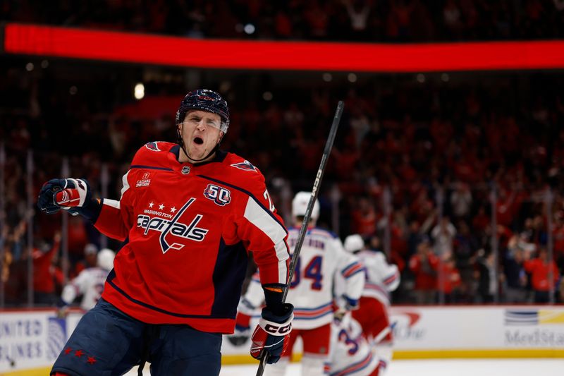 Jan 4, 2025; Washington, District of Columbia, USA; Washington Capitals center Aliaksei Protas (21) celebrates after scoring a goal against the New York Rangers in the third period at Capital One Arena. Mandatory Credit: Geoff Burke-Imagn Images