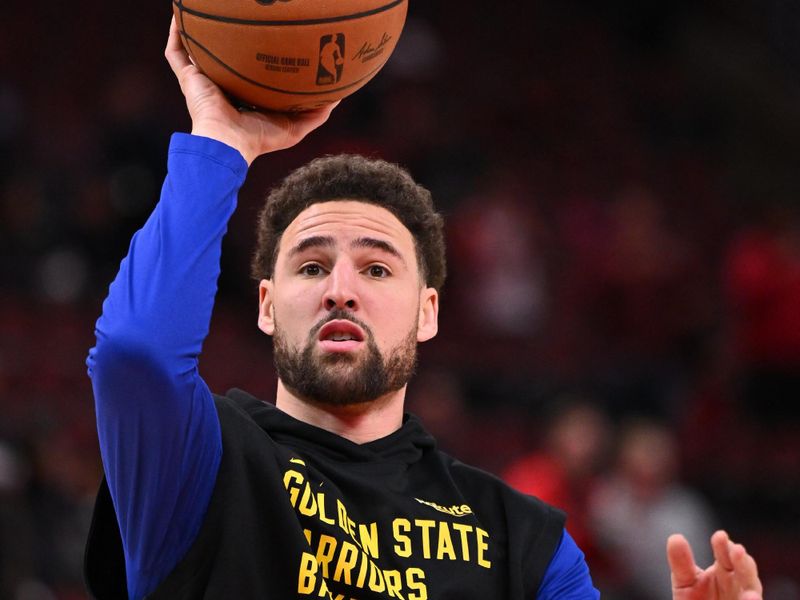 CHICAGO, ILLINOIS - JANUARY 12:  Klay Thompson #11 of the Golden State Warriors warms up before a game against the Chicago Bulls on January 12, 2024 at United Center in Chicago, Illinois.   NOTE TO USER: User expressly acknowledges and agrees that, by downloading and or using this photograph, User is consenting to the terms and conditions of the Getty Images License Agreement.  (Photo by Jamie Sabau/Getty Images)