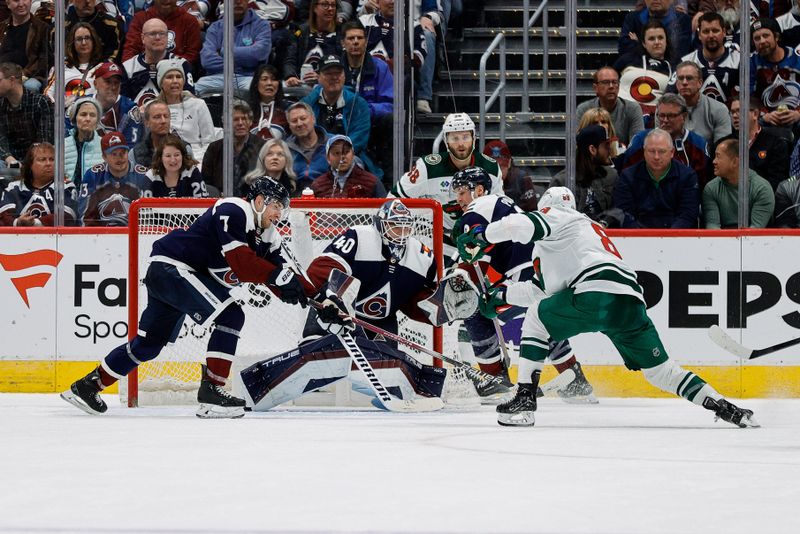 Apr 9, 2024; Denver, Colorado, USA; Colorado Avalanche goaltender Alexandar Georgiev (40) defends on a shot from Minnesota Wild center Frederick Gaudreau (89) as defenseman Devon Toews (7) and left wing Zach Parise (9) and right wing Ryan Hartman (38) look on in the second period at Ball Arena. Mandatory Credit: Isaiah J. Downing-USA TODAY Sports