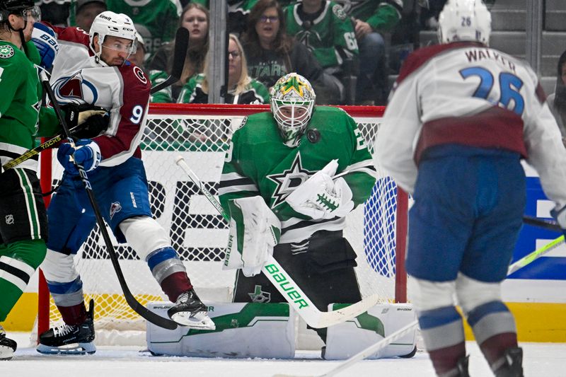 May 9, 2024; Dallas, Texas, USA; Dallas Stars goaltender Jake Oettinger (29) stops a shot by Colorado Avalanche left wing Miles Wood (28) during the second period in game two of the second round of the 2024 Stanley Cup Playoffs at American Airlines Center. Mandatory Credit: Jerome Miron-USA TODAY Sports