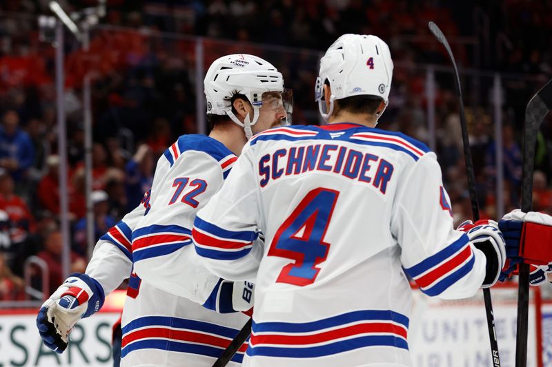 Oct 29, 2024; Washington, District of Columbia, USA; New York Rangers center Filip Chytil (72) celebrates with teammates after scoring a goal against the Washington Capitals in the second period at Capital One Arena. Mandatory Credit: Geoff Burke-Imagn Images