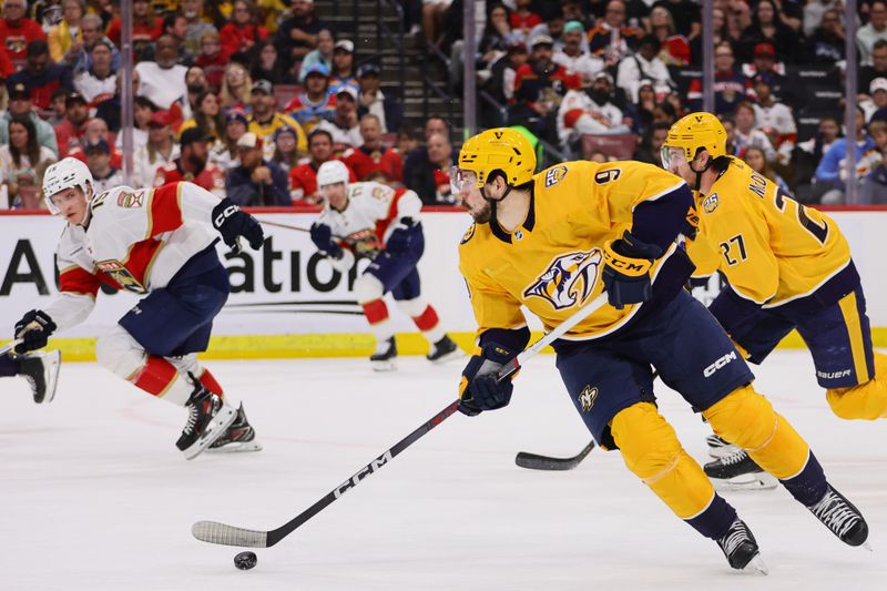 Mar 21, 2024; Sunrise, Florida, USA; Nashville Predators left wing Filip Forsberg (9) moves the puck against the Florida Panthers during the second period at Amerant Bank Arena. Mandatory Credit: Sam Navarro-USA TODAY Sports