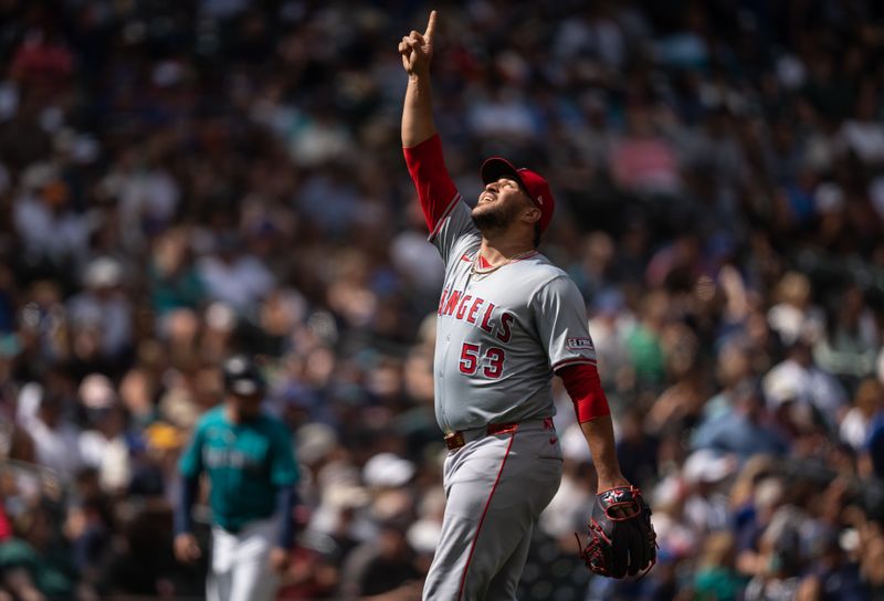 Jul 24, 2024; Seattle, Washington, USA;  Los Angeles Angels relief pitcher Carlos Estevez (53) celebrates after a game against the Seattle Mariners at T-Mobile Park. Mandatory Credit: Stephen Brashear-USA TODAY Sports