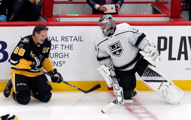 Feb 18, 2024; Pittsburgh, Pennsylvania, USA;  Pittsburgh Penguins former right wing Jaromir Jagr (68) laughs with Los Angeles Kings goaltender David Rittich (31) before the Penguins play the Kings at PPG Paints Arena. Mandatory Credit: Charles LeClaire-USA TODAY Sports