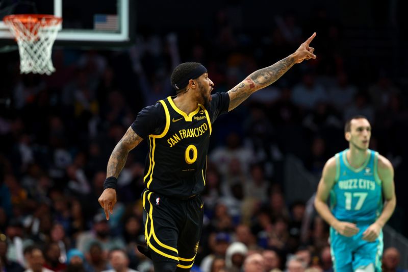 CHARLOTTE, NORTH CAROLINA - MARCH 29: Gary Payton II #0 of the Golden State Warriors reacts during the second half of the game against the Charlotte Hornets at Spectrum Center on March 29, 2024 in Charlotte, North Carolina. NOTE TO USER: User expressly acknowledges and agrees that, by downloading and or using this photograph, User is consenting to the terms and conditions of the Getty Images License Agreement. (Photo by Jared C. Tilton/Getty Images)