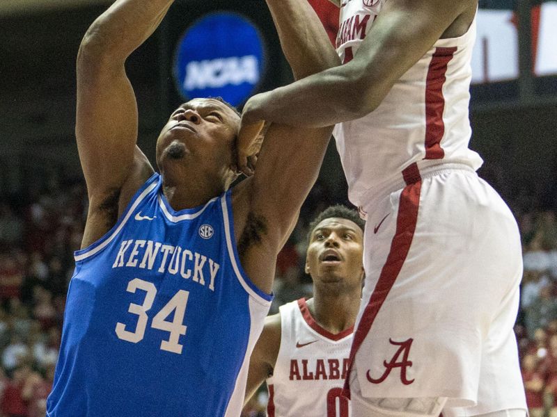 Jan 7, 2023; Tuscaloosa, Alabama, USA; Alabama Crimson Tide center Charles Bediako (14) goes for a rebound along with Kentucky Wildcats forward Oscar Tshiebwe (34) during first half at Coleman Coliseum. Mandatory Credit: Marvin Gentry-USA TODAY Sports