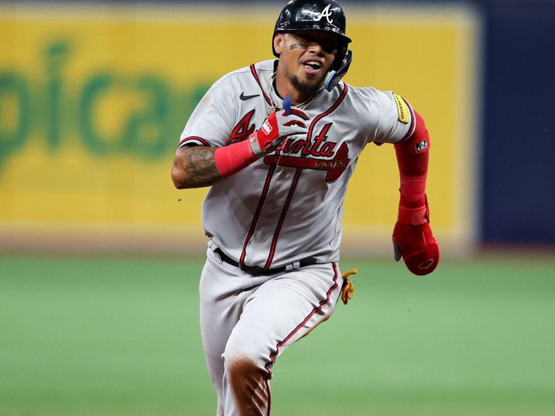 Jul 8, 2023; St. Petersburg, Florida, USA;  Atlanta Braves shortstop Orlando Arcia (11) rounds second base to score a run against the Tampa Bay Rays in the ninth inning at Tropicana Field. Mandatory Credit: Nathan Ray Seebeck-USA TODAY Sports