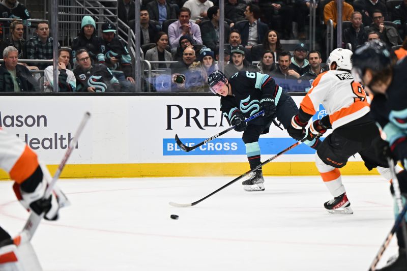 Feb 16, 2023; Seattle, Washington, USA; Seattle Kraken center Morgan Geekie (67) shoots the puck against the Philadelphia Flyers during the first period at Climate Pledge Arena. Mandatory Credit: Steven Bisig-USA TODAY Sports