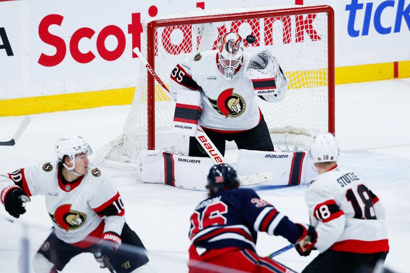 Dec 15, 2025; Winnipeg, Manitoba, CAN;  Ottawa Senators goalie Linus Ullmark (35) tracks a shot by Winnipeg Jets forward Morgan Barron (36) during the third period at Canada Life Centre. Mandatory Credit: Terrence Lee-Imagn Images