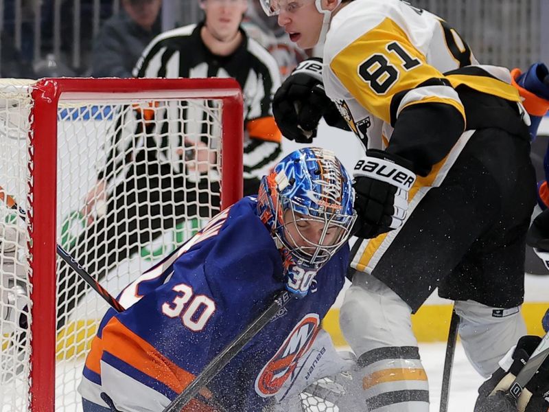 Feb 3, 2026; Elmont, New York, USA; New York Islanders goaltender Ilya Sorokin (30) makes a save in front of Pittsburgh Penguins center Ben Kindel (81) during the third period at UBS Arena. Mandatory Credit: Brad Penner-Imagn Images