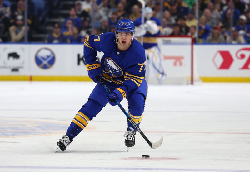 Oct 22, 2024; Buffalo, New York, USA;  Buffalo Sabres right wing JJ Peterka (77) carries the puck up ice during the second period against the Dallas Stars at KeyBank Center. Mandatory Credit: Timothy T. Ludwig-Imagn Images