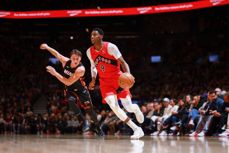 TORONTO, CANADA - DECEMBER 01:  RJ Barrett #9 of the Toronto Raptors drives to the basket during the game against the Miami Heat on December 1, 2024 at the Scotiabank Arena in Toronto, Ontario, Canada.  NOTE TO USER: User expressly acknowledges and agrees that, by downloading and or using this Photograph, user is consenting to the terms and conditions of the Getty Images License Agreement.  Mandatory Copyright Notice: Copyright 2024 NBAE (Photo by Vaughn Ridley/NBAE via Getty Images)