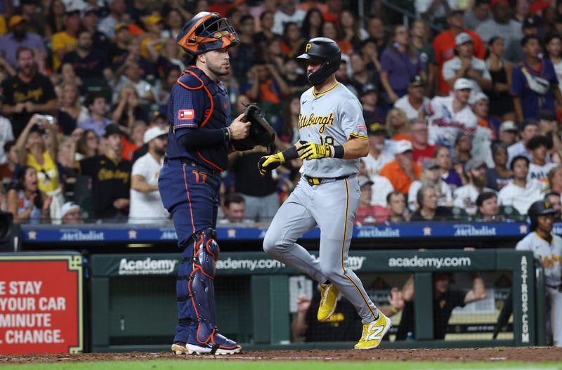 Jul 29, 2024; Houston, Texas, USA; Pittsburgh Pirates second baseman Jared Triolo (19) scores a run past Houston Astros catcher Victor Caratini (17) during the eighth inning at Minute Maid Park. Mandatory Credit: Troy Taormina-USA TODAY Sports