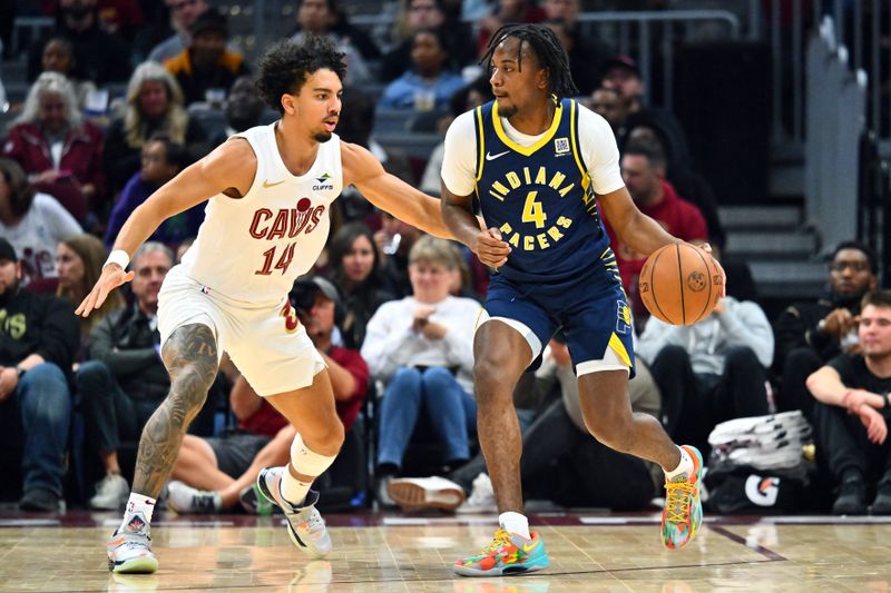 CLEVELAND, OHIO - OCTOBER 10: Tristen Newton #4 of the Indiana Pacers drives handles the ball against Jules Bernard #14 of the Cleveland Cavaliers during the second half of a preseason game at Rocket Mortgage Fieldhouse on October 10, 2024 in Cleveland, Ohio. The Pacers defeated the Cavaliers 129-117. NOTE TO USER: User expressly acknowledges and agrees that, by downloading and or using this photograph, User is consenting to the terms and conditions of the Getty Images License Agreement. (Photo by Jason Miller/Getty Images)