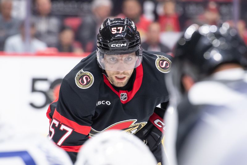 Sep 24, 2024; Ottawa, Ontario, CAN; Ottawa Senato left wing David Perron (57) lines up for a faceoff in the first period  against the Toronto Maple Leafs at the Canadian Tire Centre. Mandatory Credit: Marc DesRosiers-Imagn Images