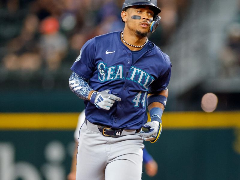 Sep 21, 2024; Arlington, Texas, USA; Seattle Mariners outfielder Julio Rodríguez (44) hits a home run on the first pitch of the game against the Texas Rangers at Globe Life Field. Mandatory Credit: Andrew Dieb-Imagn Images