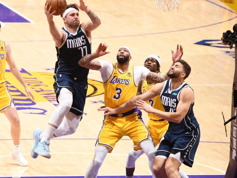 LOS ANGELES, CA - JANUARY 17:  Luka Doncic #77 of the Dallas Mavericks goes to the basket during the game on January 17, 2024 at Crypto.Com Arena in Los Angeles, California. NOTE TO USER: User expressly acknowledges and agrees that, by downloading and/or using this Photograph, user is consenting to the terms and conditions of the Getty Images License Agreement. Mandatory Copyright Notice: Copyright 2024 NBAE (Photo by Andrew D. Bernstein/NBAE via Getty Images)