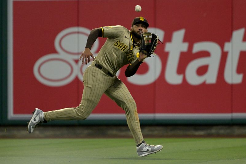 Jun 5, 2024; Anaheim, California, USA;  San Diego Padres right fielder Fernando Tatis Jr. (23) makes a running catch off a ball hit by Los Angeles Angels second baseman Kyren Paris (19) in the seventh inning at Angel Stadium. Mandatory Credit: Jayne Kamin-Oncea-USA TODAY Sports