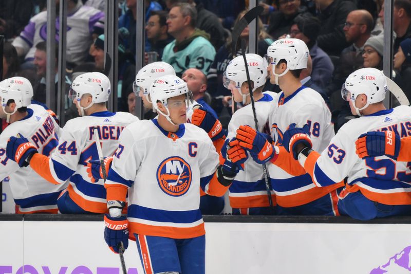 Nov 16, 2023; Seattle, Washington, USA; New York Islanders left wing Anders Lee (27) celebrates with the bench after scoring a goal against the Seattle Kraken during the first period at Climate Pledge Arena. Mandatory Credit: Steven Bisig-USA TODAY Sports