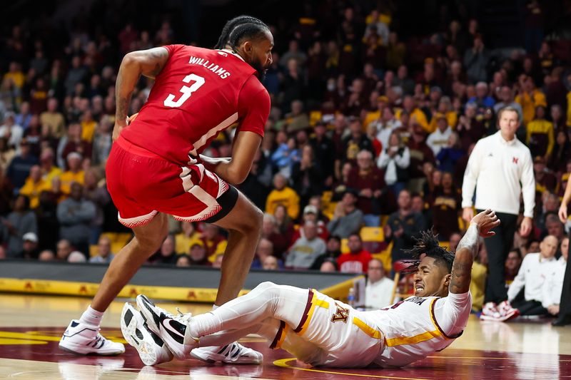 Dec 6, 2023; Minneapolis, Minnesota, USA; Nebraska Cornhuskers guard Brice Williams (3) is charged with an offensive foul against Minnesota Golden Gophers guard Elijah Hawkins (0) during the second half at Williams Arena. Mandatory Credit: Matt Krohn-USA TODAY Sports