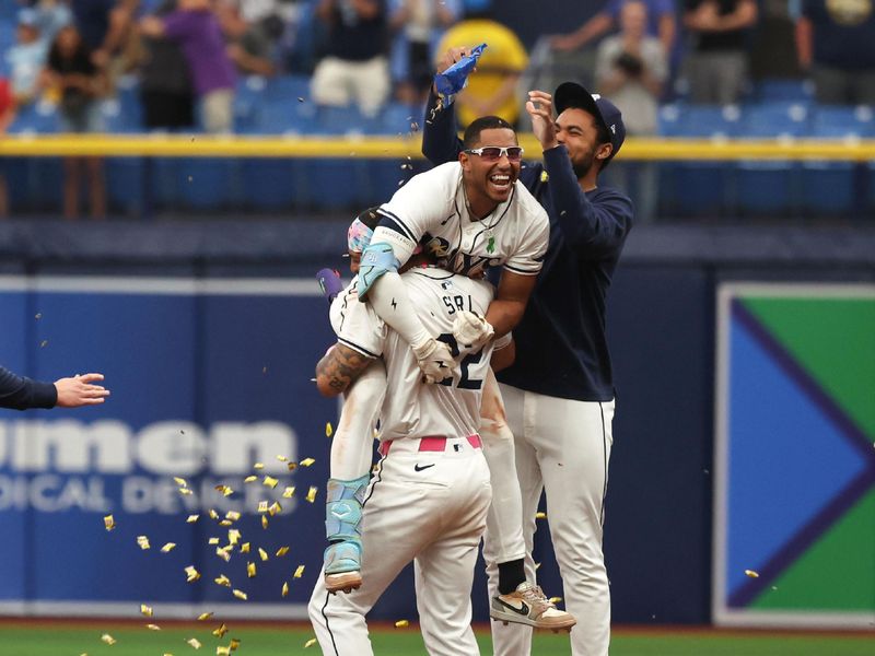 May 30, 2024; St. Petersburg, Florida, USA; Tampa Bay Rays outfielder Richie Palacios (1) celebrates with outfielder Jose Siri (22) and teammates after hitting a walk off RBI single against the Oakland Athletics during the eleventh inning at Tropicana Field. Mandatory Credit: Kim Klement Neitzel-USA TODAY Sports