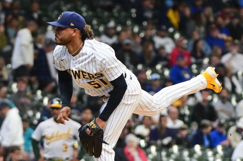 Jun 11, 2023; Milwaukee, Wisconsin, USA; Milwaukee Brewers pitcher Freddy Peralta (51) pitches against the Oakland Athletes in the first inning at American Family Field. Mandatory Credit: Benny Sieu-USA TODAY Sports