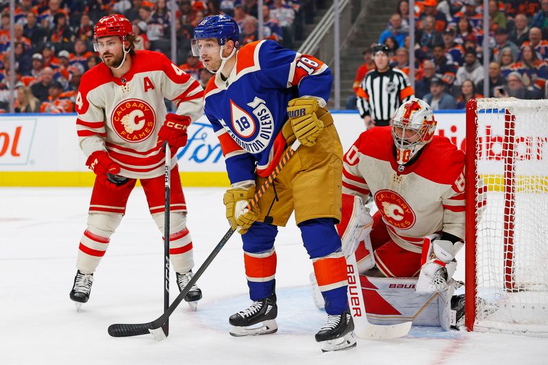 Feb 24, 2024; Edmonton, Alberta, CAN; Edmonton Oilers forward Zach Hyman (18) tries to screen Calgary Flames goaltender Dan Vladar (80) during the first period at Rogers Place. Mandatory Credit: Perry Nelson-USA TODAY Sports