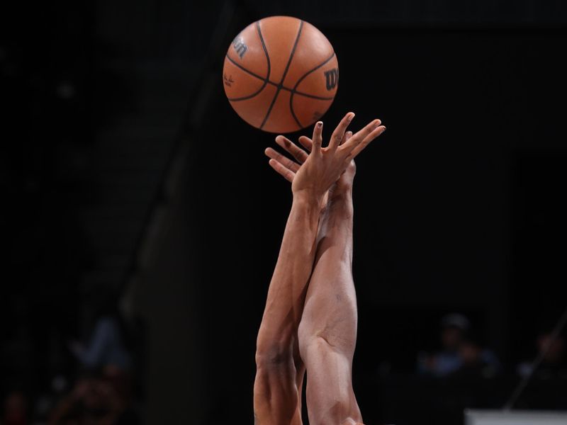 BROOKLYN, NY - JANUARY 15: Nicolas Claxton #33 of the Brooklyn Nets and Bam Adebayo #13 of the Miami Heat go up for the opening tip off during the game on January 15, 2024 at Barclays Center in Brooklyn, New York. NOTE TO USER: User expressly acknowledges and agrees that, by downloading and or using this Photograph, user is consenting to the terms and conditions of the Getty Images License Agreement. Mandatory Copyright Notice: Copyright 2024 NBAE (Photo by Nathaniel S. Butler/NBAE via Getty Images)