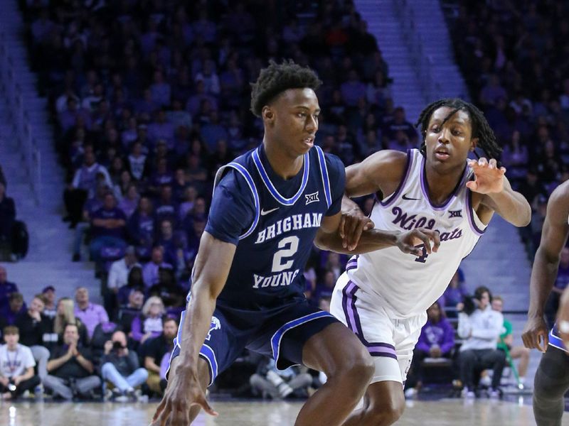 Feb 24, 2024; Manhattan, Kansas, USA; Brigham Young Cougars guard Jaxson Robinson (2) dribbles against Kansas State Wildcats guard Dai Dai Ames (4) during the second half at Bramlage Coliseum. Mandatory Credit: Scott Sewell-USA TODAY Sports