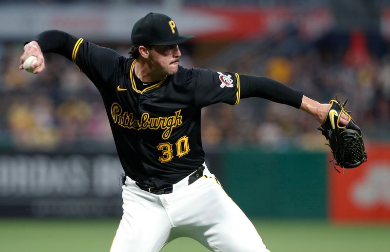 Jun 17, 2024; Pittsburgh, Pennsylvania, USA;  Pittsburgh Pirates starting pitcher Paul Skenes (30) throws to first base to retire Cincinnati Reds catcher Tyler Stephenson (not pictured) to end the sixth inning at PNC Park. Mandatory Credit: Charles LeClaire-USA TODAY Sports