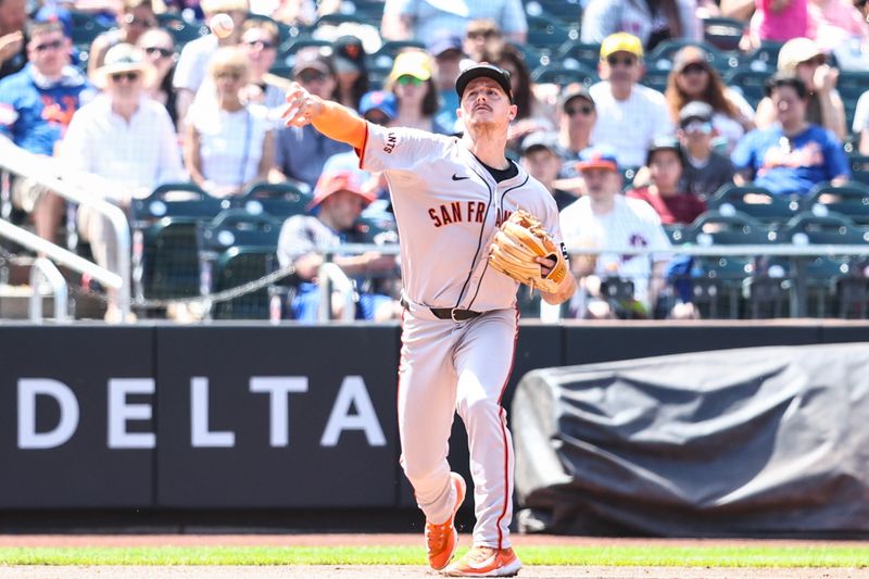 May 25, 2024; New York City, New York, USA;  San Francisco Giants third baseman Matt Chapman (26) throws a runner out for an assist in the fourth inning against the New York Mets at Citi Field. Mandatory Credit: Wendell Cruz-USA TODAY Sports
