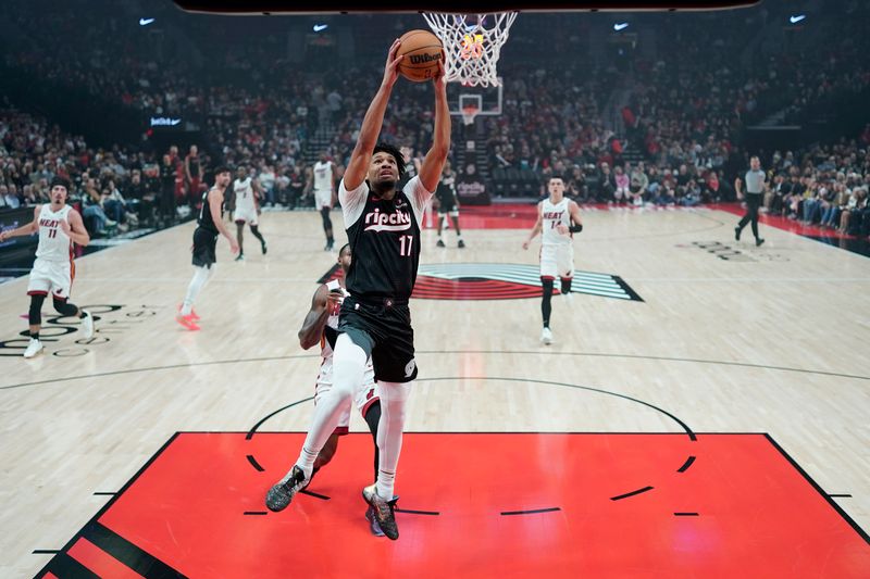 PORTLAND, OREGON - JANUARY 11: Shaedon Sharpe #17 of the Portland Trail Blazers dunks the ball during the first half against the Miami Heat at Moda Center on January 11, 2025 in Portland, Oregon. NOTE TO USER: User expressly acknowledges and agrees that, by downloading and or using this photograph, User is consenting to the terms and conditions of the Getty Images License Agreement. (Photo by Soobum Im/Getty Images)