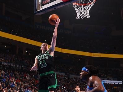 OKLAHOMA CITY, OK - JANUARY 2: Payton Pritchard #11 of the Boston Celtics drives to the basket during the game against the Oklahoma City Thunder on January 2, 2024 at Paycom Arena in Oklahoma City, Oklahoma. NOTE TO USER: User expressly acknowledges and agrees that, by downloading and or using this photograph, User is consenting to the terms and conditions of the Getty Images License Agreement. Mandatory Copyright Notice: Copyright 2024 NBAE (Photo by Zach Beeker/NBAE via Getty Images)